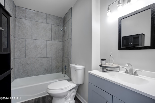 full bath featuring toilet, shower / bathtub combination, and vanity