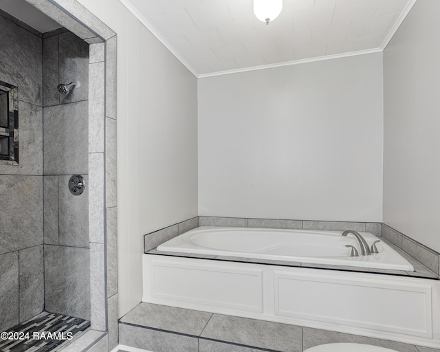 full bath featuring a garden tub, ornamental molding, and tiled shower