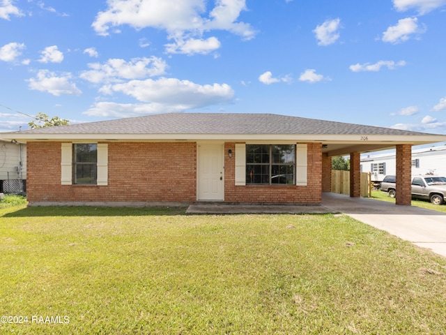 single story home featuring a front lawn and a carport