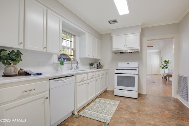 kitchen with white appliances, backsplash, sink, ornamental molding, and white cabinetry