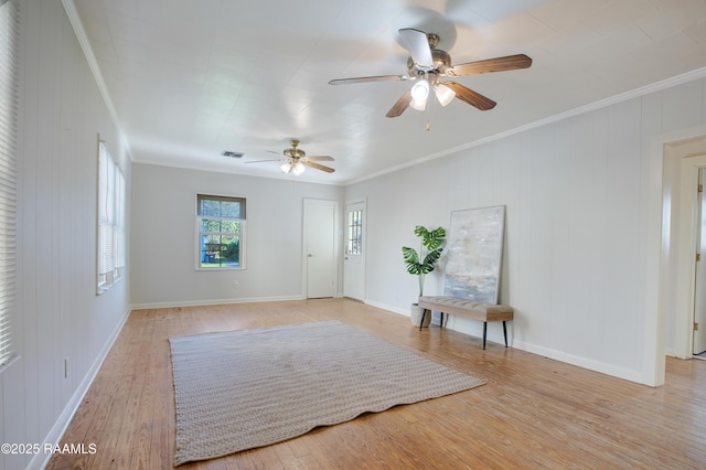 entryway featuring ceiling fan, light hardwood / wood-style floors, and ornamental molding