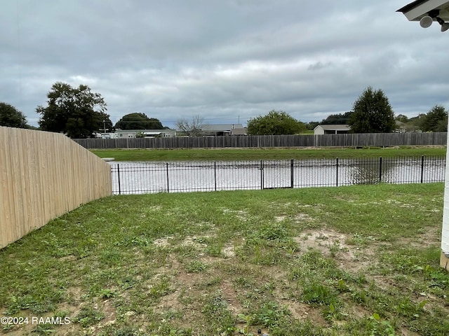 view of yard with a water view