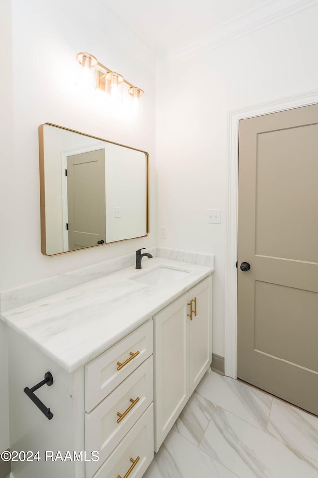 bathroom featuring vanity and ornamental molding