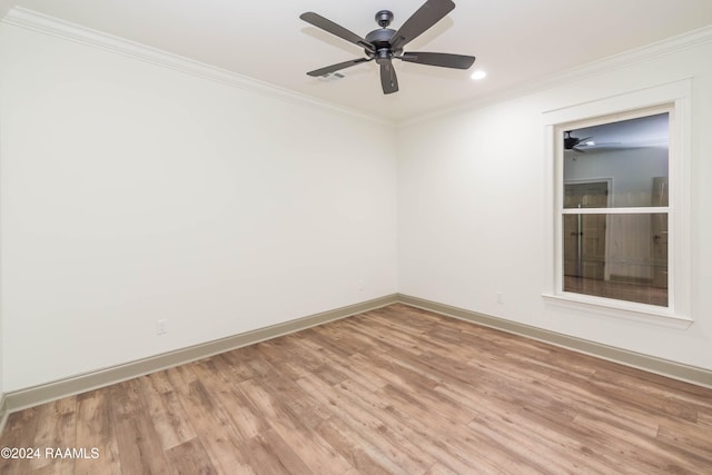 spare room with light hardwood / wood-style floors and ornamental molding