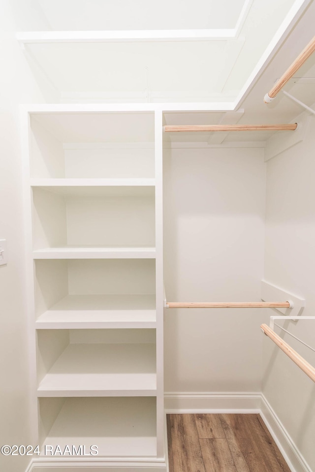 walk in closet featuring wood-type flooring