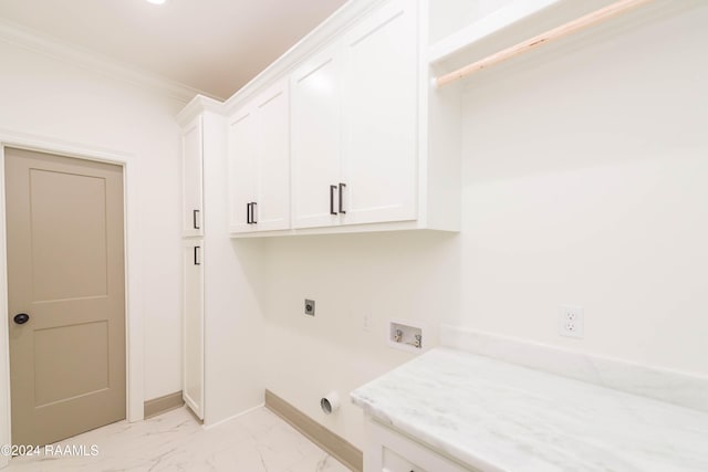 laundry area featuring cabinets, hookup for a washing machine, crown molding, and electric dryer hookup