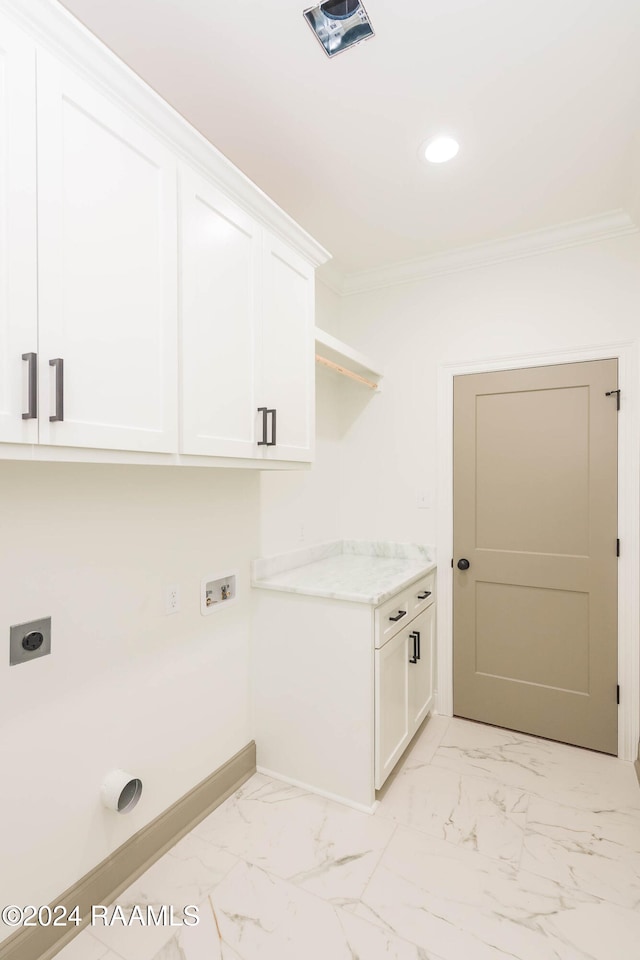 laundry room featuring hookup for an electric dryer, cabinets, crown molding, and washer hookup