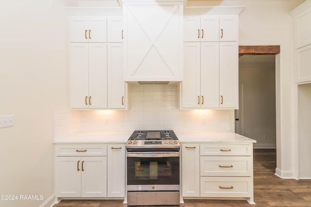 kitchen featuring stainless steel range and white cabinetry