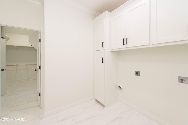 laundry room featuring hookup for an electric dryer, cabinets, ornamental molding, and hookup for a washing machine