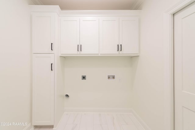 clothes washing area with cabinets, hookup for a washing machine, ornamental molding, and hookup for an electric dryer