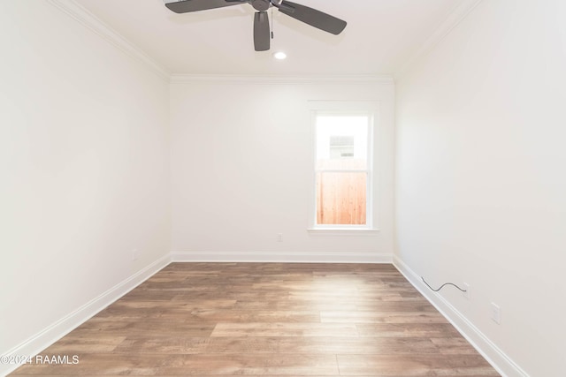 empty room featuring hardwood / wood-style flooring, ceiling fan, and crown molding