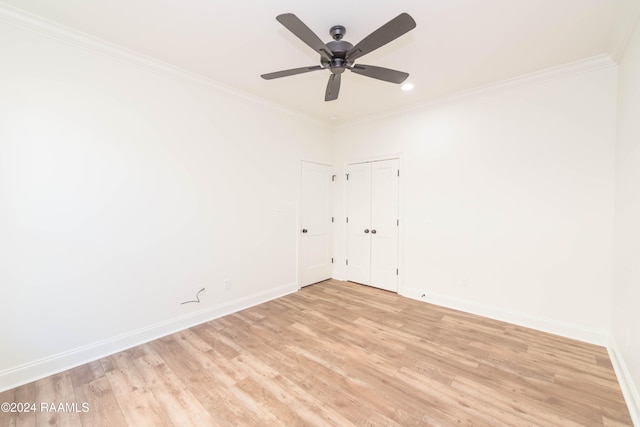 spare room featuring ceiling fan, light hardwood / wood-style floors, and ornamental molding