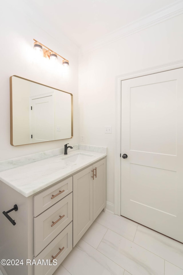 bathroom featuring vanity and crown molding