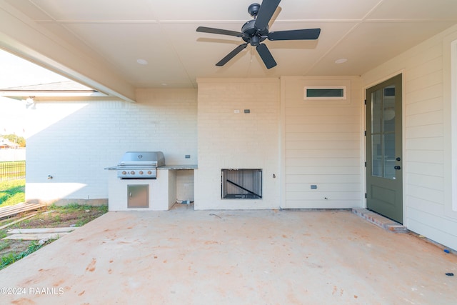 view of patio with ceiling fan and a grill