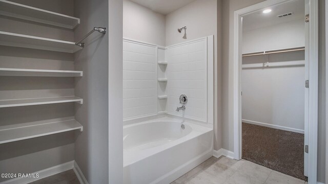 bathroom with shower / tub combination