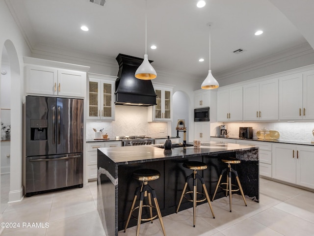 kitchen with custom exhaust hood, stove, a sink, fridge with ice dispenser, and built in microwave