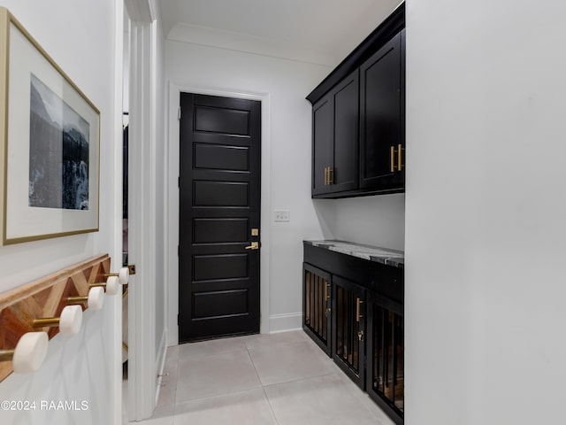 interior space featuring light tile patterned floors and baseboards