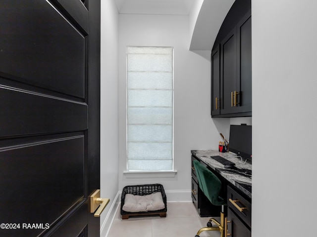 tiled home office featuring baseboards