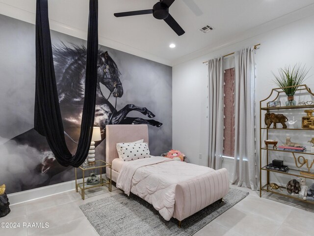 bedroom with light tile patterned floors, ornamental molding, and ceiling fan