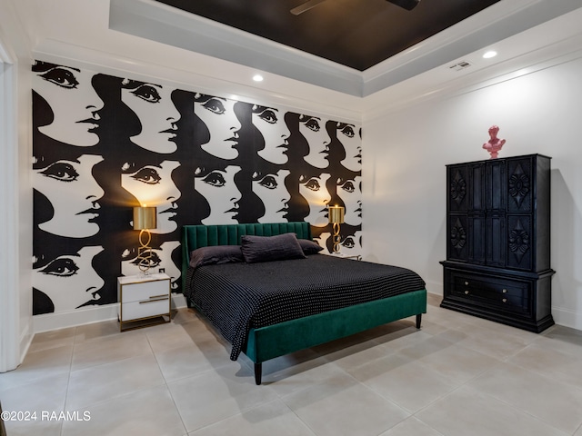 bedroom with a tray ceiling, ceiling fan, and light tile patterned floors