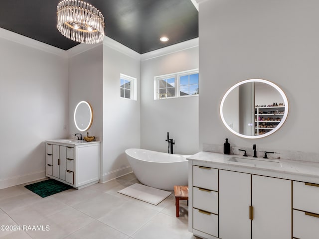 bathroom featuring a soaking tub, two vanities, an inviting chandelier, a sink, and tile patterned flooring