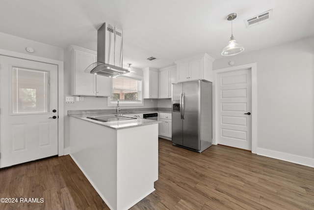 kitchen featuring visible vents, a peninsula, island exhaust hood, stainless steel appliances, and white cabinetry