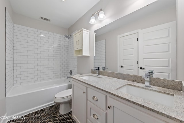 full bathroom featuring visible vents, toilet, bathing tub / shower combination, and a sink