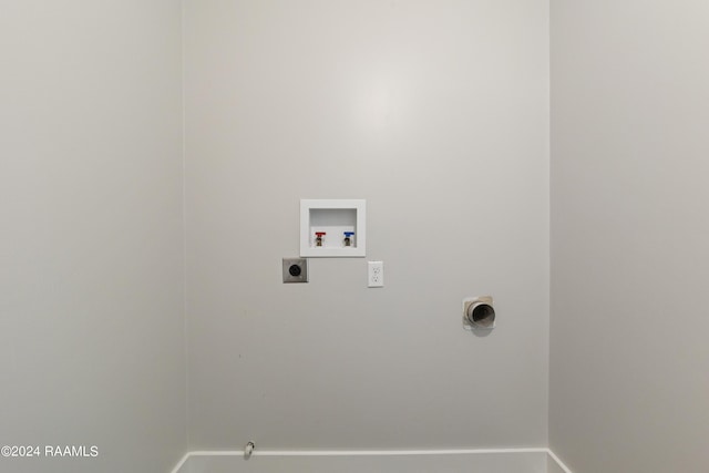 washroom featuring hookup for an electric dryer, washer hookup, baseboards, gas dryer hookup, and laundry area