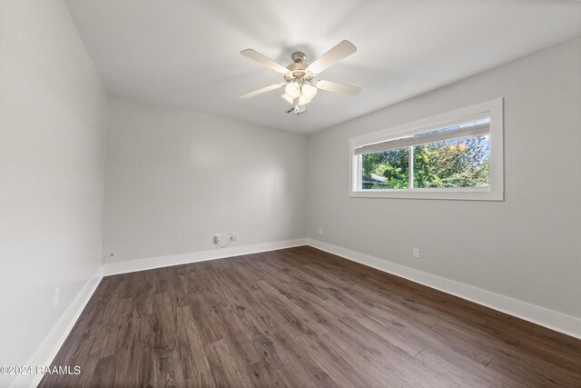 empty room with ceiling fan and wood-type flooring