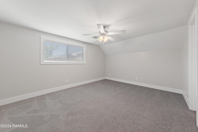 bonus room featuring a ceiling fan, lofted ceiling, carpet, and baseboards