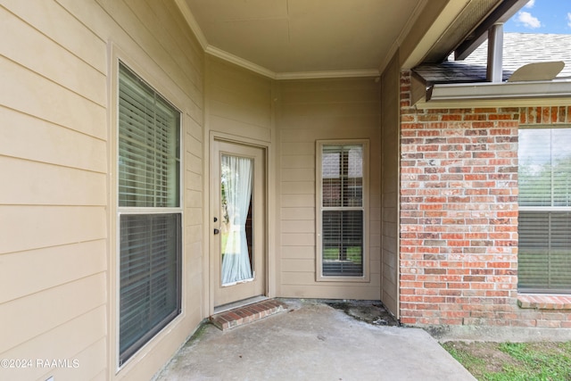 property entrance with a patio