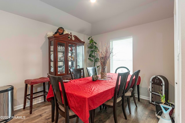 dining space with wood-type flooring