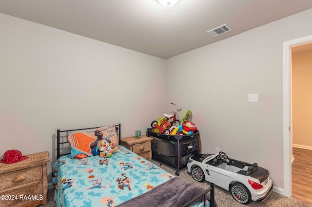 bedroom featuring wood-type flooring