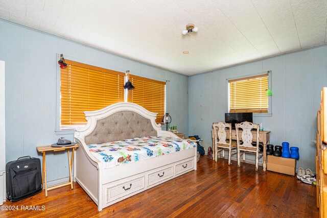 bedroom featuring dark hardwood / wood-style flooring