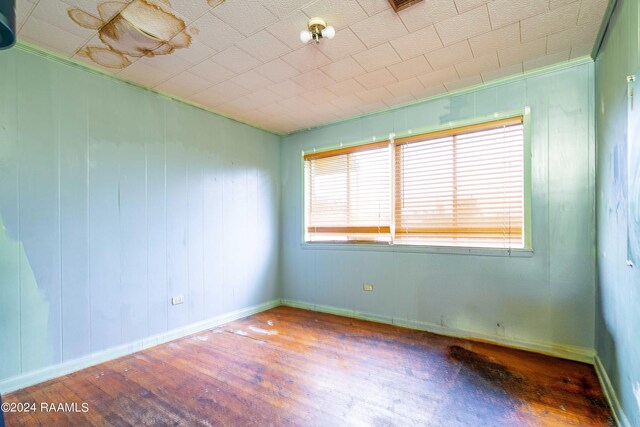 empty room with hardwood / wood-style floors