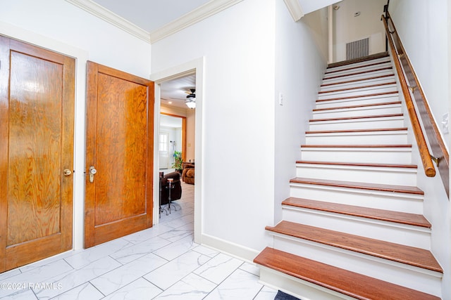 stairs with visible vents, marble finish floor, baseboards, and ornamental molding