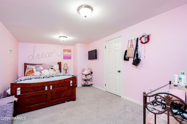 carpeted bedroom with baseboards