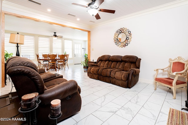 living room featuring visible vents, crown molding, baseboards, marble finish floor, and a ceiling fan