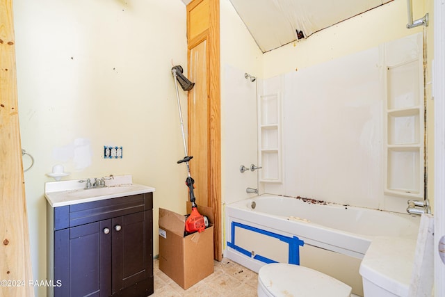 bathroom with shower / washtub combination, toilet, and vanity