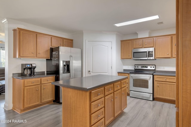 kitchen featuring a kitchen island, light hardwood / wood-style floors, crown molding, and stainless steel appliances