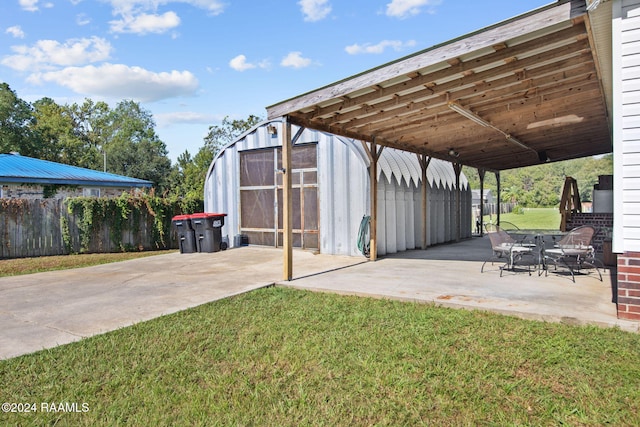 view of patio / terrace featuring a shed