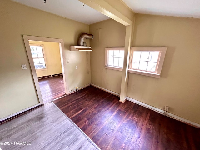 spare room featuring wood finished floors