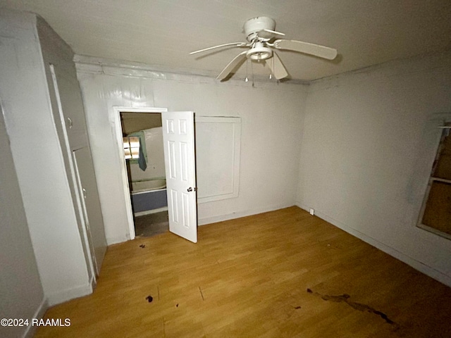 spare room with ceiling fan and light wood-style floors