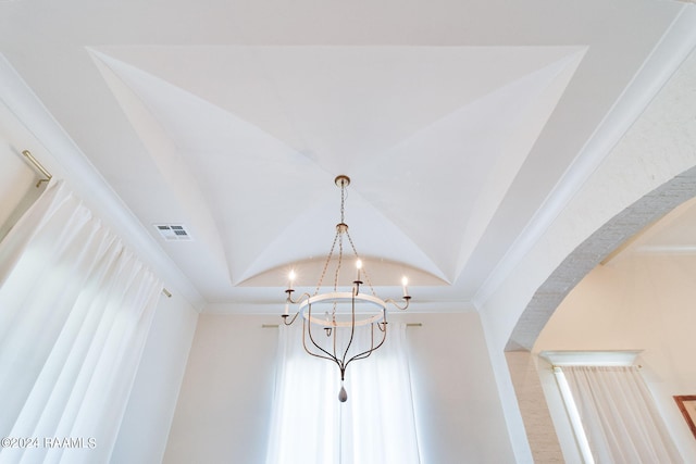 details with crown molding and a chandelier