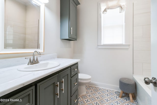 bathroom featuring a bath, toilet, tile patterned floors, and vanity