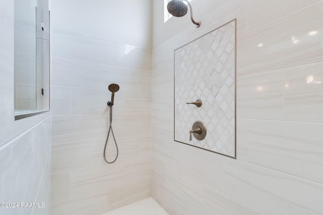 bathroom with a tile shower