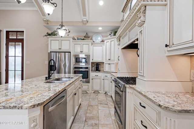 kitchen with appliances with stainless steel finishes, sink, hanging light fixtures, and light stone counters