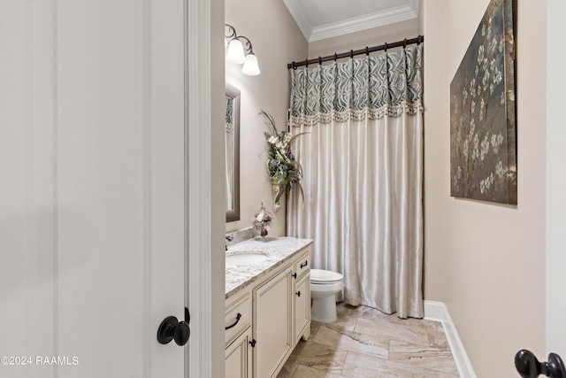 bathroom with toilet, baseboards, crown molding, and vanity