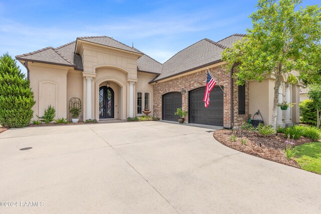 view of front of home with a garage