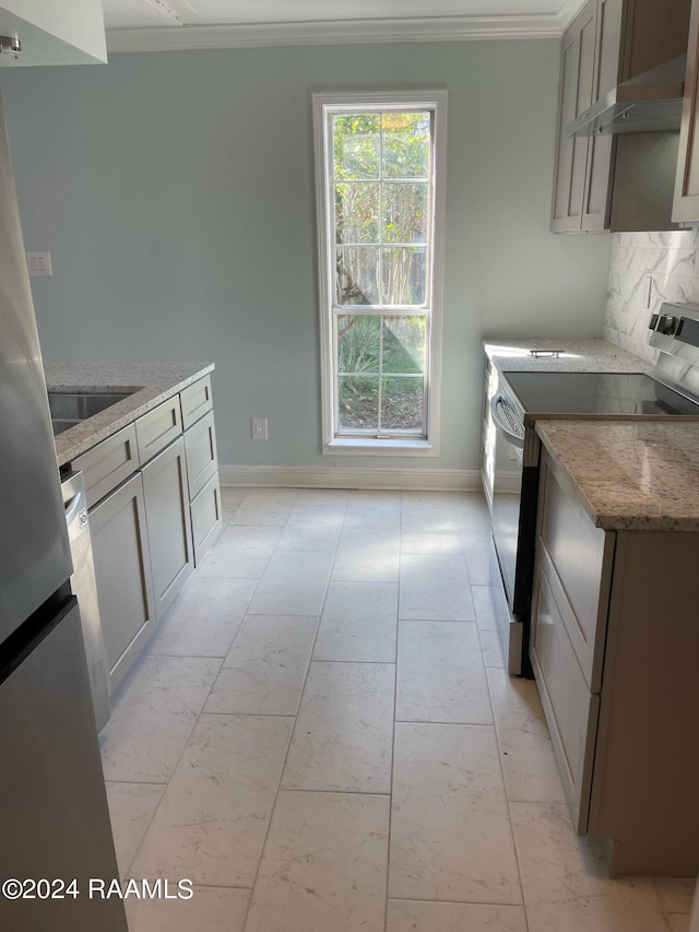 kitchen featuring decorative backsplash, stone countertops, light tile patterned floors, crown molding, and range with electric stovetop